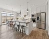 Former showhome, with lots of large windows to let in extra natural light, white kitchen with upgraded tile, cabinetry and appliances