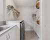 Upper Floor Laundry thoughtfully positioned between the Primary Retreat and Main Living Area, complete with Built-In Shelving and a Utility Sink for added convenience and everyday functionality.