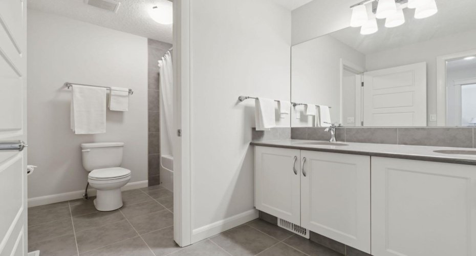 Main bathroom with shower and lots of counter space