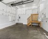 The HEATED GARAGE is a mechanic’s dream, fully equipped with extensive built-in cabinetry, abundant lighting, multiple power outlets including 240V service, hot and cold water, a central vacuum outlet, high-rail garage door, hoisting beam, and exhaust fan—creating the ultimate workshop or hobby space