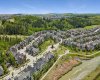 Nestled in along the environmental reserve of trees and the bow river