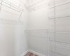 Primary bedroom walk in closet