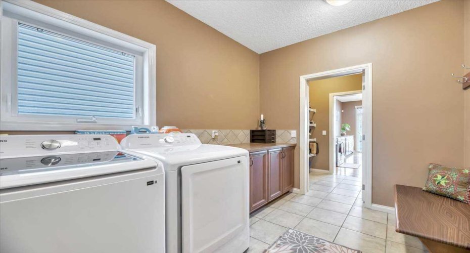 Great utility with this mudroom / laundry room.