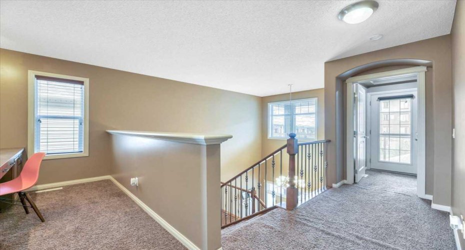 Upper level open area with built-in desk.