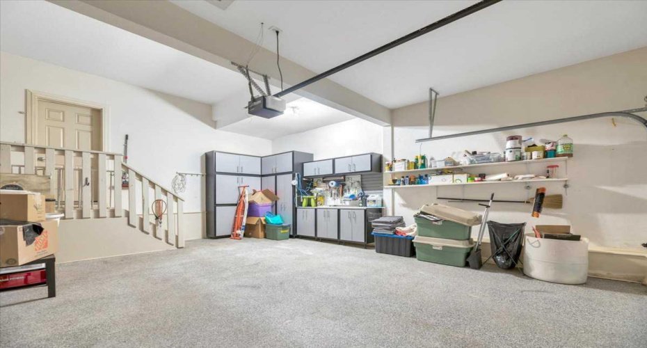 Finished garage with epoxy flooring and cabinets to finish the pacakage.
