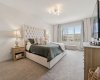 Primary Bedroom with Oversized Windows and River Views right from your bed