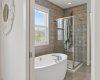 Leading from the Primary Bedroom you will find a Luxury 5 pc Ensuite with Soaker Tub, Tiled Shower, Double Sinks and Closets