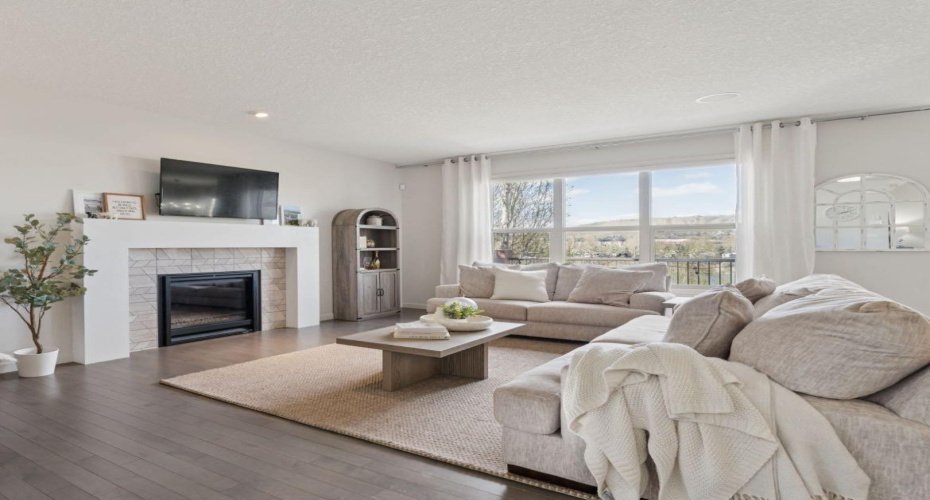 Bright & Airy Living Room with a Cozy Gas Fireplace