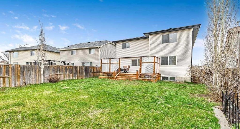Fully fenced back yard complete with dog run that has access to a dog door entering the garage