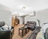 Carpeted lower level Rumpus room with large Well window