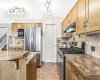 Counterspace and cupboards galore and adjacent to walkthrough pantry to the garage