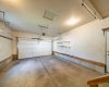 Double, oversized garage with man door to backyard