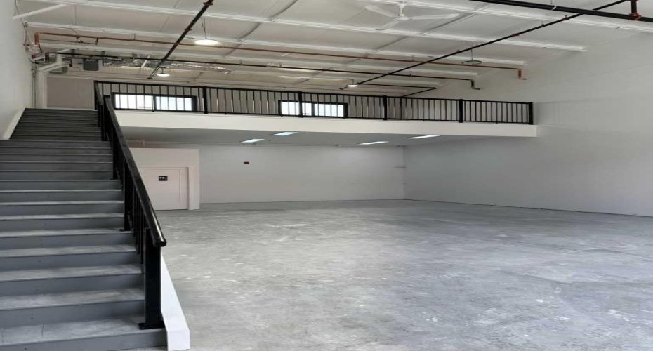Mid construction with mezzanine and stairs in