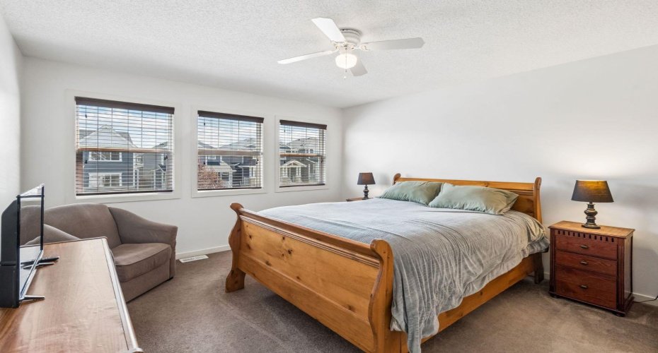 Primary bedroom draws you in with the natural light coming from the multiple windows.