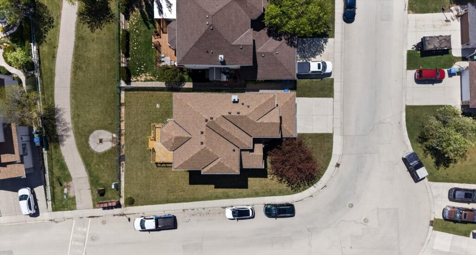 Large corner lot offering extra parking space, privacy, and incredible curb appeal.