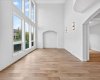 Living room with an an abundance of natural light with SIX oversized windows