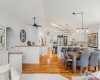 The  area offers generous space to gather - perfect for both everyday living and entertaining—and connects seamlessly to the kitchen and breakfast nook.