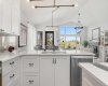 Undermount lighting, corner pantry, motion sensored hood fan, gorgeous fixtures