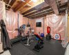 There is also ample unfinished space for future development including a gym, playroom, storage, and expanded laundry area.