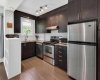 Great kitchen layout with modern white, subway tile backsplash and stainless steel appliances, ready for your cullinary experiences.