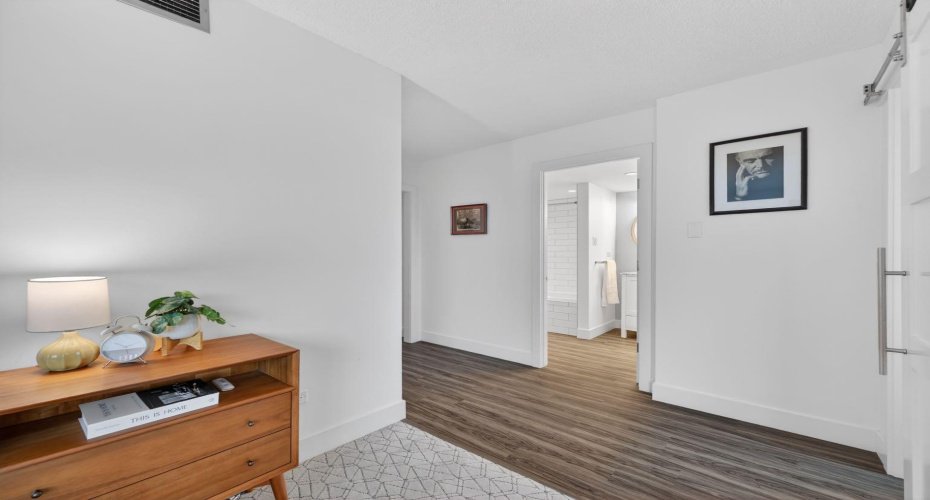Primary Bedroom - includes unique expansive configuration with access to both Ensuite and Office via Barn Doors