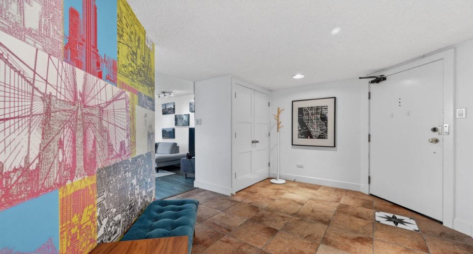 Enjoy a surprising entrance into a large round foyer with vibrant mural