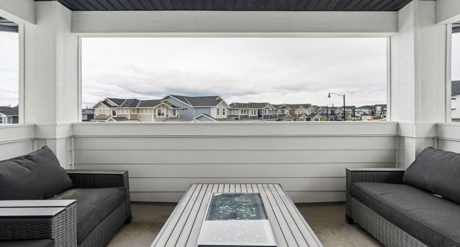 A covered front balcony allows your to take in the fresh air no matter the weather