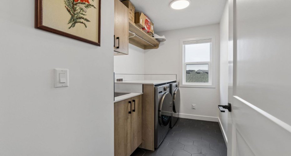 Upper floor laundry with a sink keeps life easy and convenient