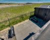 Down below is a concrete patio.
