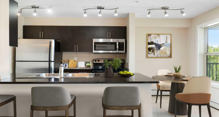 Kitchen w/Breakfast Bar & Dinette - Staged