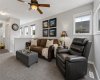 Separate from the main floor entertaining spaces, this inviting bonus room provides the perfect balance of togetherness and privacy. Large windows bring in natural light, creating a bright and welcoming environment for relaxation, work, hobbies, or family time.