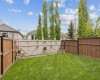 The fully fenced backyard provides a secure and low-maintenance outdoor space for children, pets, gardening, or simply enjoying sunny afternoons. Mature trees and thoughtful landscaping add charm and privacy.