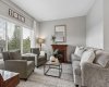Comfort and connection come together in this inviting living room. Whether you're hosting friends, enjoying family movie nights, or curling up with a good book beside the fireplace, this space effortlessly adapts to every season of life.