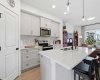 Ample storage and workspace with corner pantry.