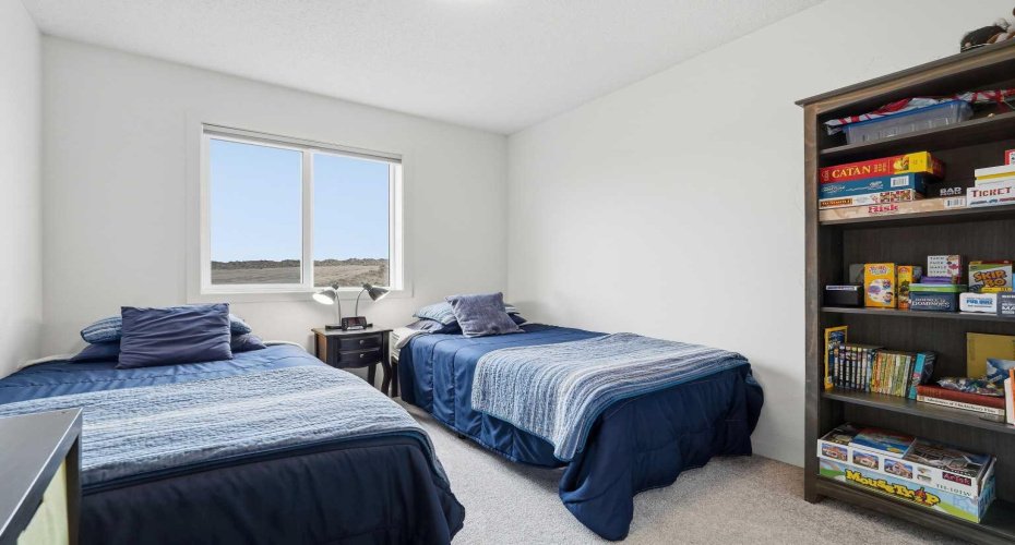 secondary bedroom upstairs, perfect for kids or guests alike.