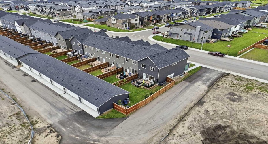 paved alley way with access to detached oversized double garage.