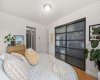Spacious bedroom with room for larger furnishings and a bright, airy atmosphere.