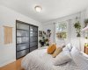 Spacious bedroom with room for larger furnishings and a bright, airy atmosphere.