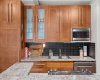 Bright and functional kitchen featuring warm cabinetry
