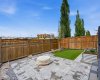 Low maintenance backyard with fire pit