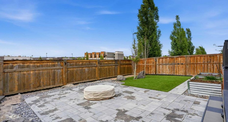 Low maintenance backyard with fire pit