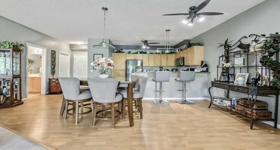Photo taken from living room looking at dining area and kitchen