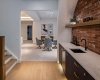 Brick Feature Wall Wet Bar with Underlit Shelving.