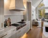Wolf Gas Cooktop and Microcement Range Hood.
