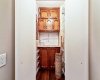 Just off the entry is a versatile workshop or hobby area with excellent shelving & storage.
