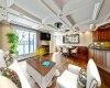 Rich in detail, with coffered ceilings throughout & recessed lighting, a refined feature typically reserved for high-end homes. (Sofa & décor accents virtually staged).