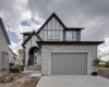 Front of Home with Double Attached Garage and Concrete Driveway