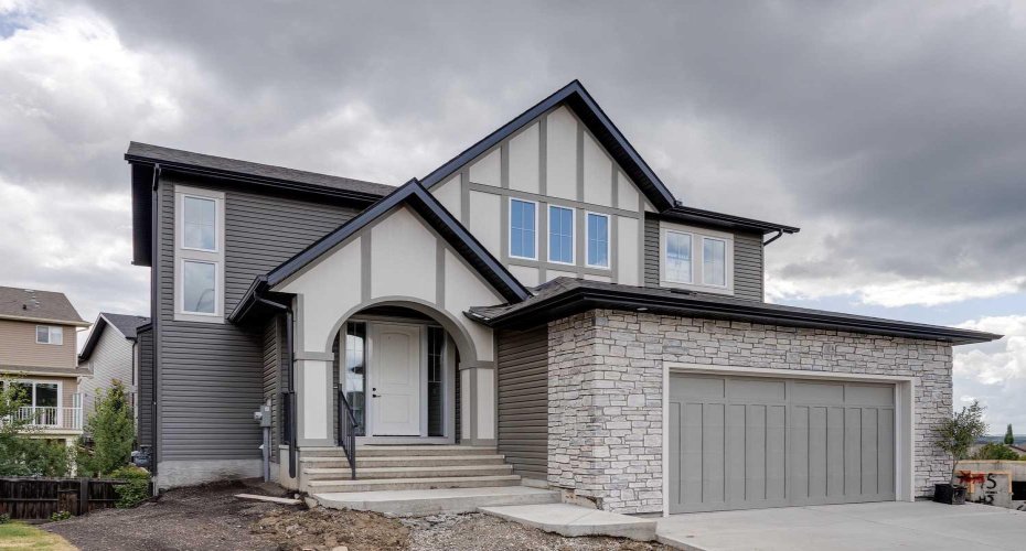 Front of Home with Double Attached Garage and Concrete Driveway