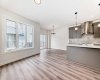 View from Great Room to Kitchen and Dining Nook • • PLEASE NOTE: Kitchen appliances are included, and will be installed prior to possession.