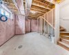 Basement with natural light and endless potential.